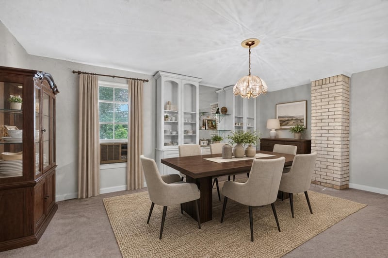 Virtually staged dining room with pendant light and built-in cabinets at 1173 US-17, Satsuma, FL 32189