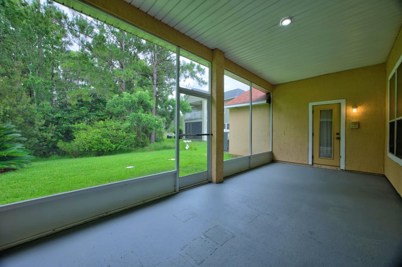 Screened, tiled lanai overlooking the yard at 635 Wakeview Dr, Orange Park, FL 32065