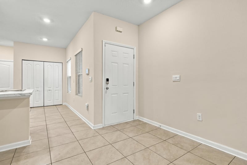 Entry area opening into kitchen with tile flooring at 9555 Star Dr, Jacksonville, FL 32256