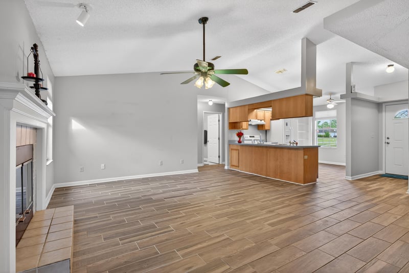 Open living area with view into kitchen at 2164 Orangewood St, Middleburg, FL 32068