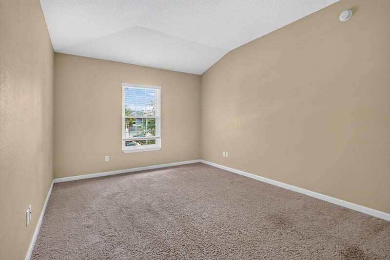 Bedroom with carpet and window at 12359 Mangrove Forest Ct, Jacksonville, FL 32218