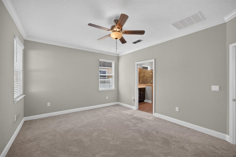 Bedroom with door to adjoining room at 331 Millerstone Dr, St. Augustine, FL 32092