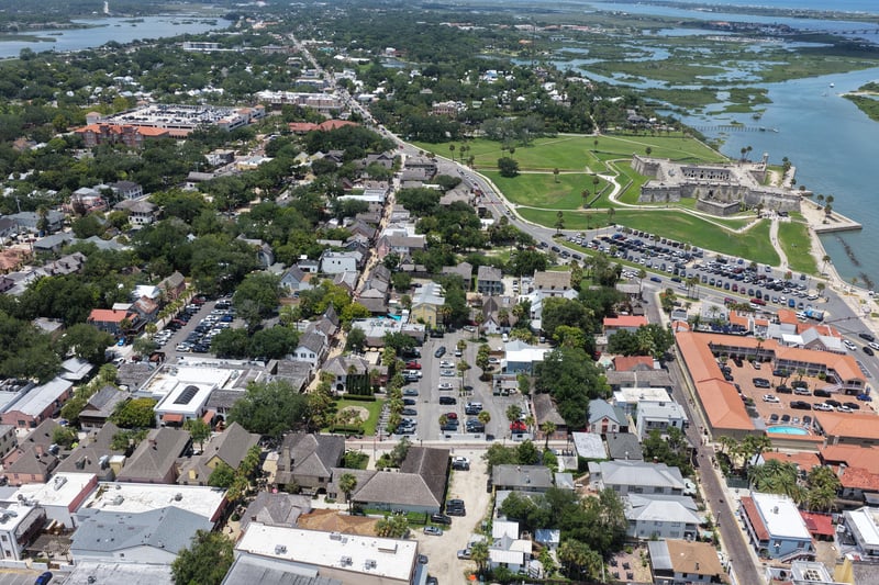 Aerial view of the marsh and historic district rooftops in St. Augustine, FL