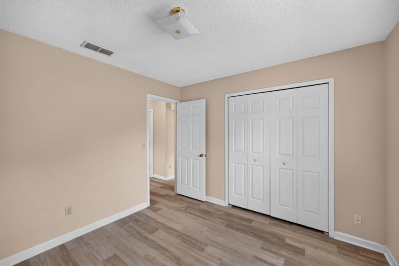 Bedroom with closet doors at 6646 Shiloh Creek Dr