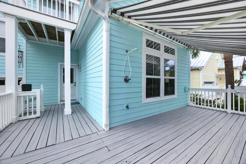 Side exterior with deck and awning at 117 Island Cottage Way, St. Augustine, FL 32080