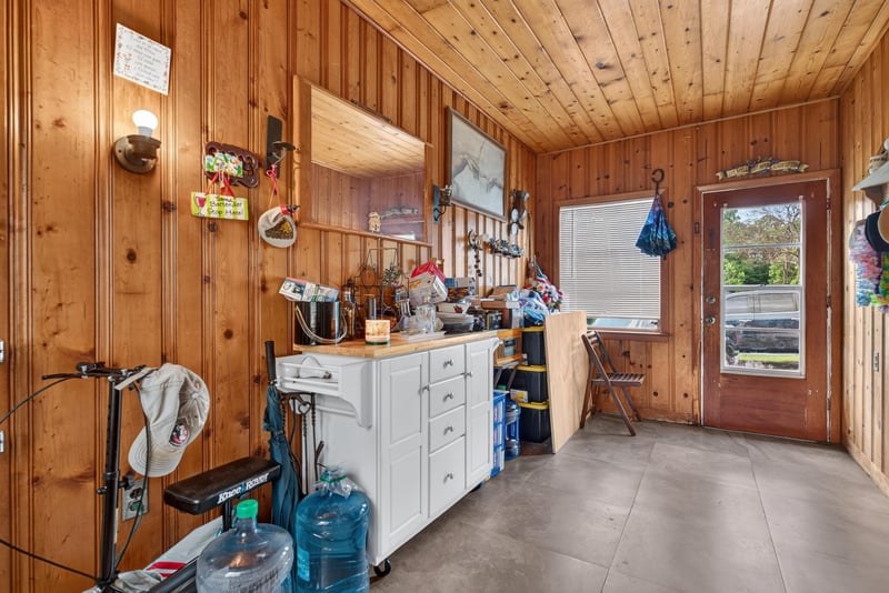 Wood-paneled kitchen and utility area at 5745 110th St, Jacksonville, FL 32244