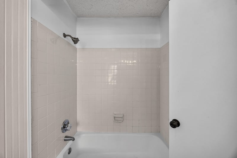 Bathroom with tile tub and shower surround at 6757 Deer Springs Rd, Keystone Heights, FL 32656