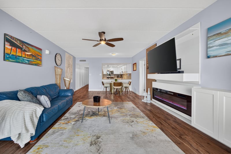 Living room with built-in fireplace cabinetry at 2280 Shepard St