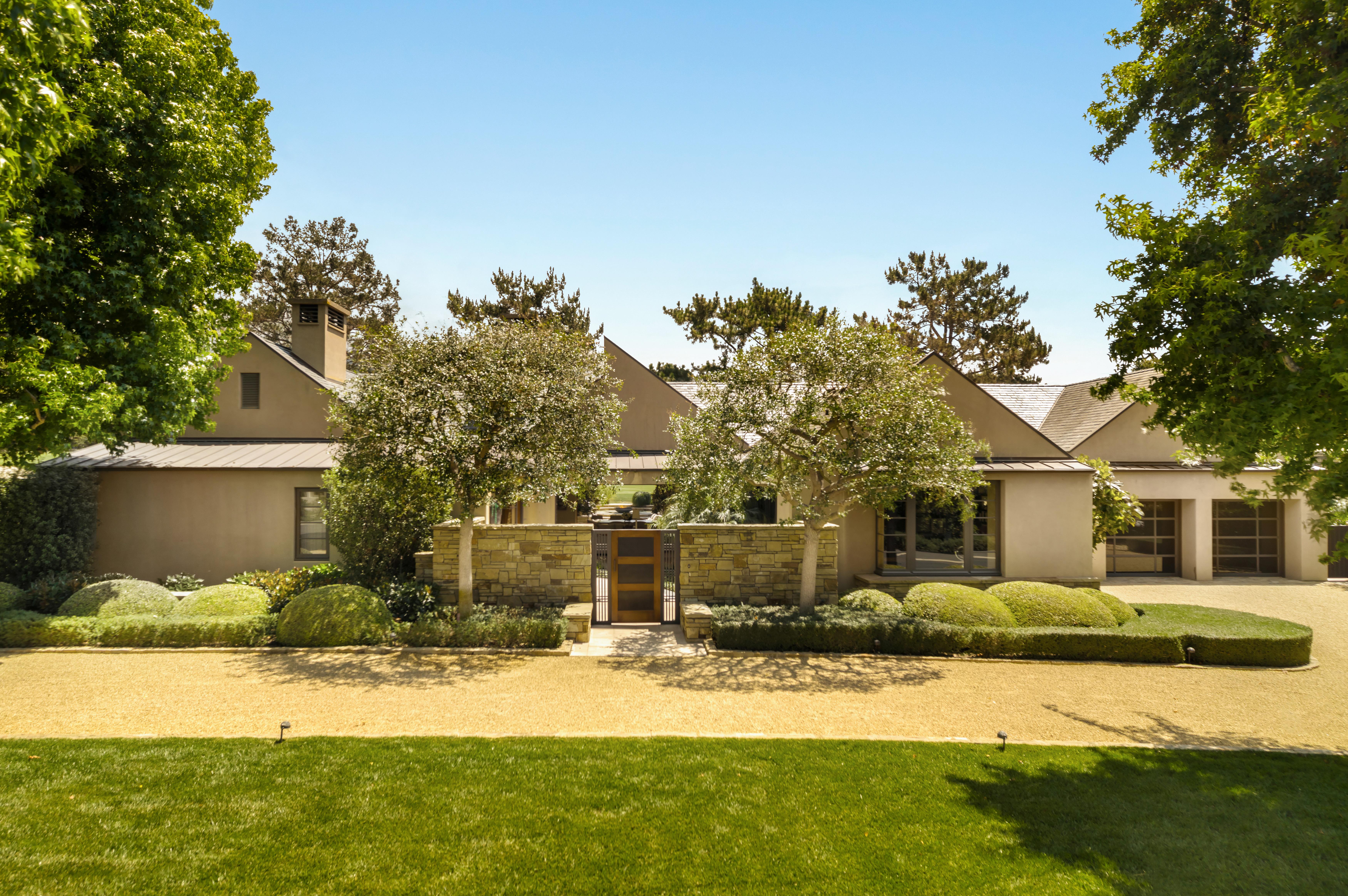 Professional real estate photography of the grand entrance and architectural facade at 468 Crocker Sperry Dr, Montecito, CA — showcasing the refined character of one of the American Riviera's most distinguished addresses. Our team captured aerial photography, a luxury property video, FPV video tour, Matterport 3D virtual tour, and 2D floor plan throughout the morning.