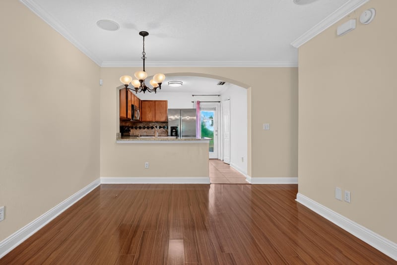 Open room facing kitchen pass-through at 353 Redwood Ln