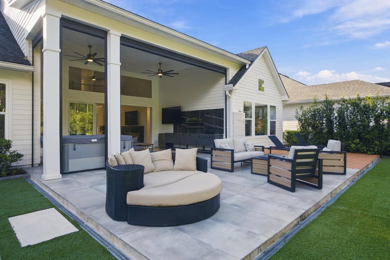 Covered patio with round daybed seating at 907 Seagrove Dr, Ponte Vedra Beach, FL 32081