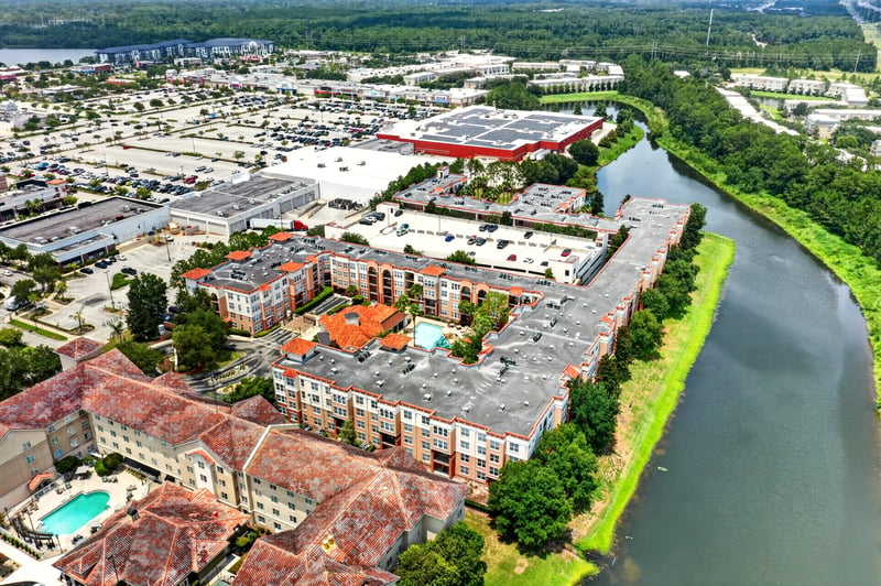 Aerial view of the condo buildings and lake in Jacksonville, FL