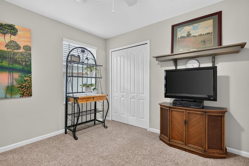 Bedroom with wall art and dresser at 4319 Green River Pl, Middleburg, FL 32068