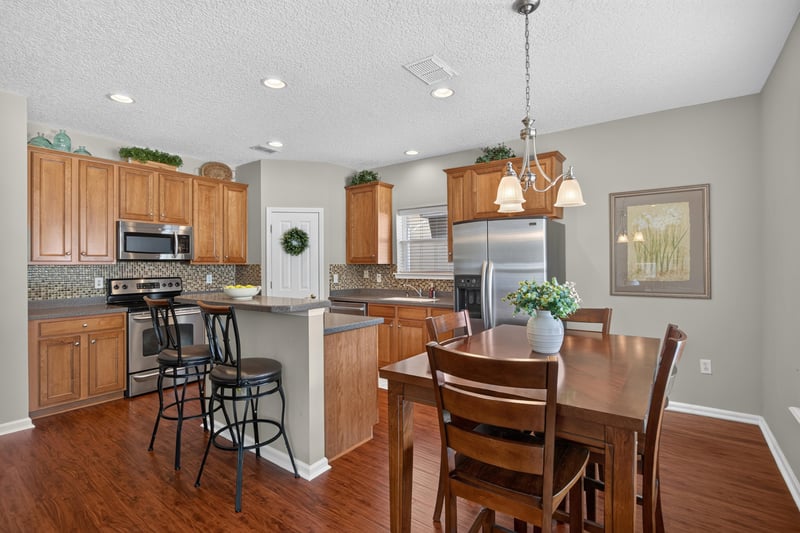 Kitchen with wood cabinets and a breakfast bar at 3660 Middlebrook Dr, Orange Park, FL 32065