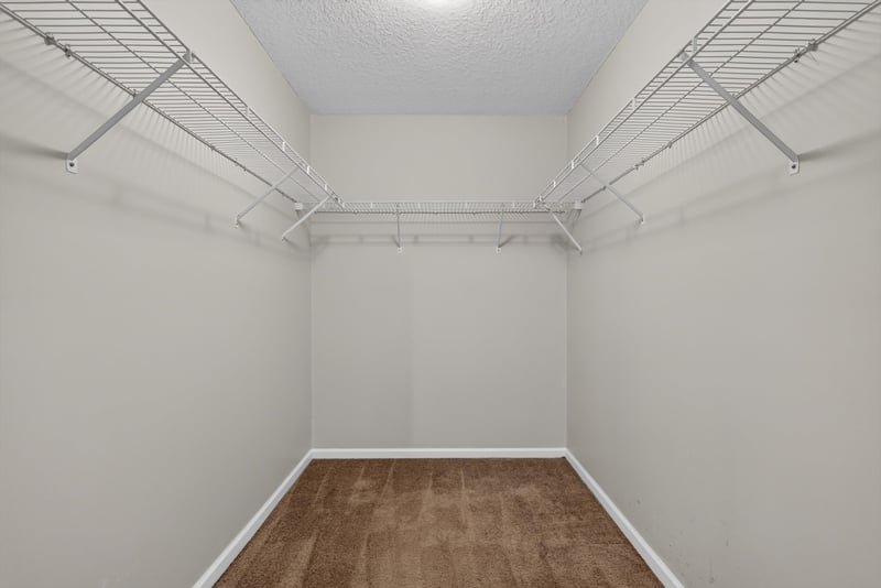Walk-in closet with wire shelving at 11669 Collins Creek Dr, Jacksonville, FL 32258