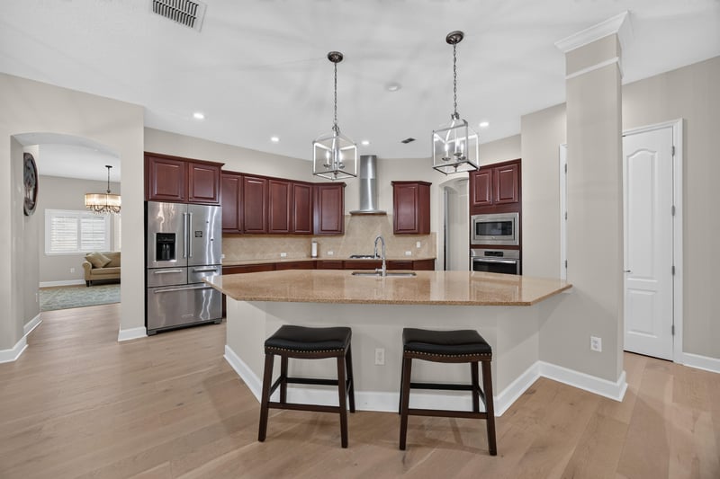Kitchen breakfast bar with wood cabinets at 276 Cross Ridge Dr, Ponte Vedra Beach, FL 32081