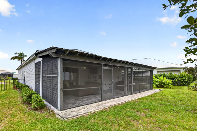 Rear of the home with screened porch at 91 Tilloo Ct, St. Johns, FL