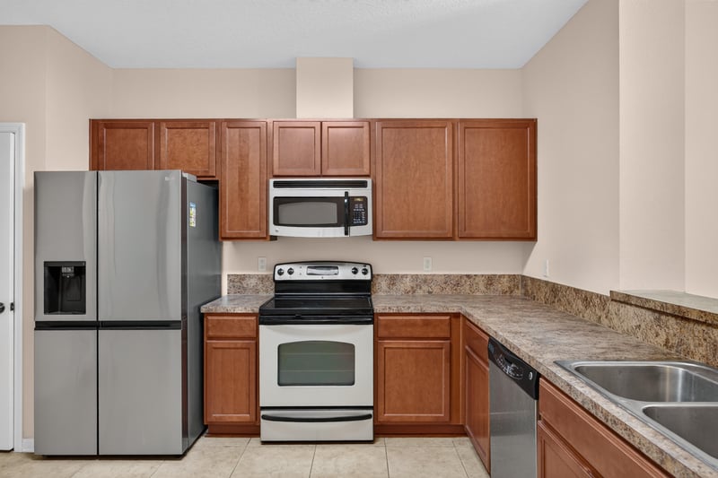 Kitchen with stainless appliances and granite counters at 3762 Hartsfield Forest Cir, Jacksonville, FL 32277