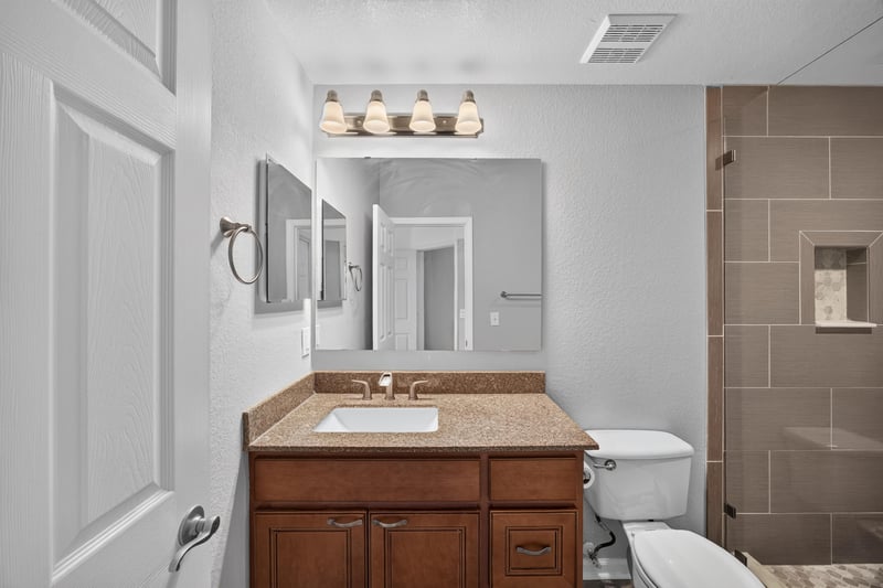 Bathroom with vanity and glass shower enclosure at 10075 Gate Pkwy unit 1905, Jacksonville, FL 32246