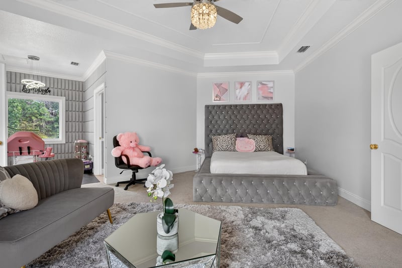 Bedroom suite with gray decor and seating area at 344 Broward Rd, Jacksonville, FL