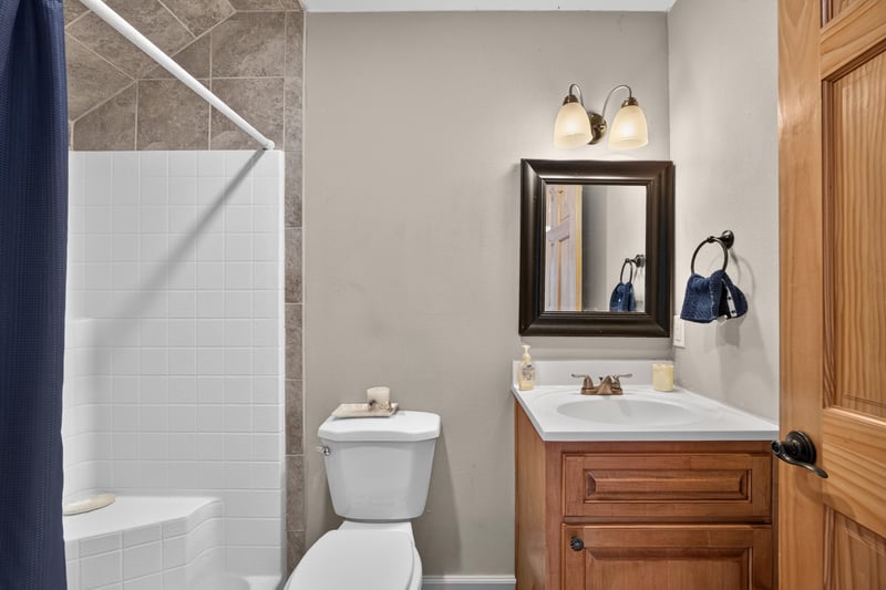 Bathroom with tiled shower and vanity at 1735 Hagans Ridge Ct