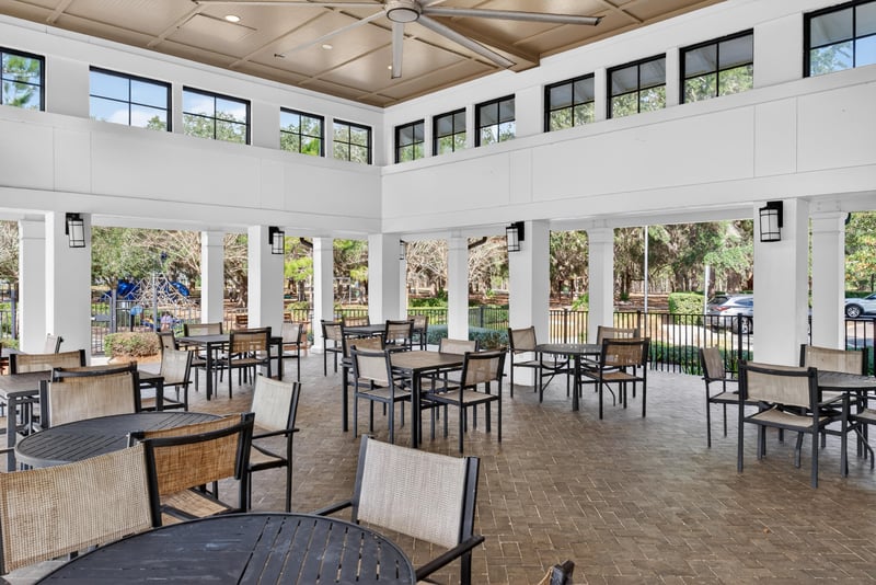 Clubhouse dining area with large windows in Whisper Creek