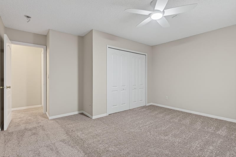 Bedroom with carpet and closet door at 1648 Glen Laurel Dr, Middleburg, FL 32068