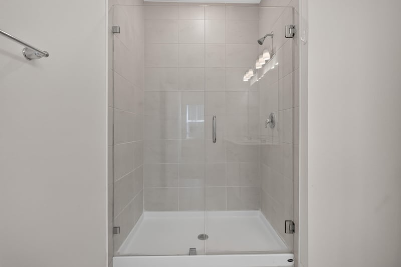 Bathroom glass-enclosed shower stall at 39 Mellowood Ln, St. Augustine, FL 32092
