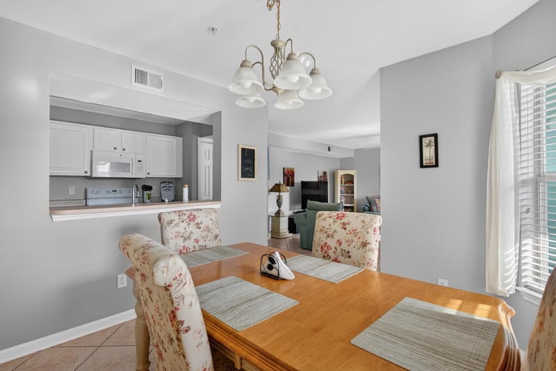 Dining area with pass-through view into the kitchen at 206 16th St, St. Augustine, FL 32080