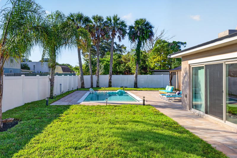 Backyard pool with privacy fence at 1525 8th St N, Jacksonville Beach, FL