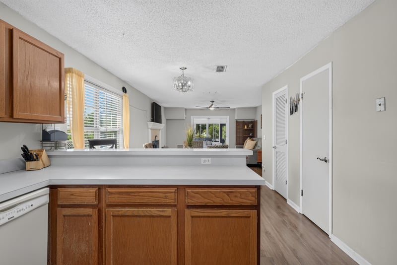 Kitchen pass-through to living room at 8680 Bandera Cir S, Jacksonville, FL 32244
