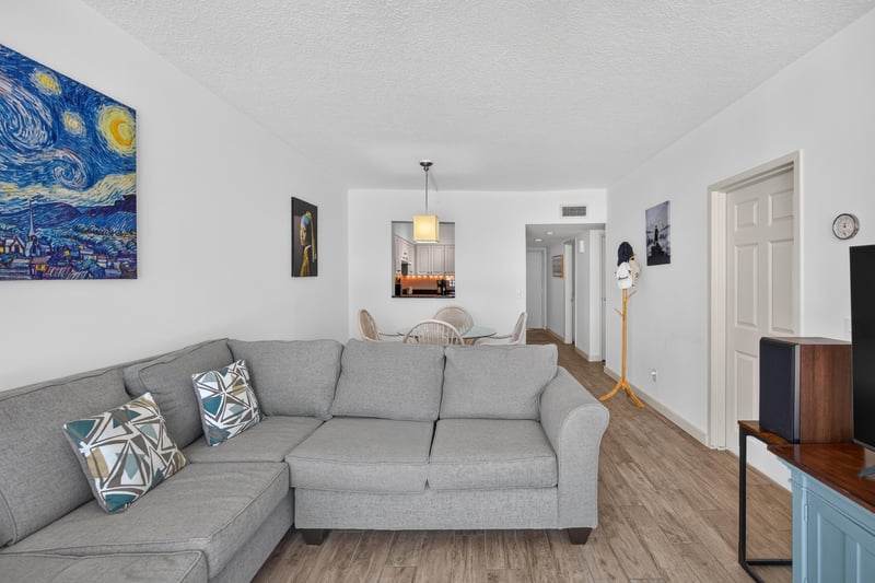 Living room with wall art and hallway view at 601 1st St S, Jacksonville Beach