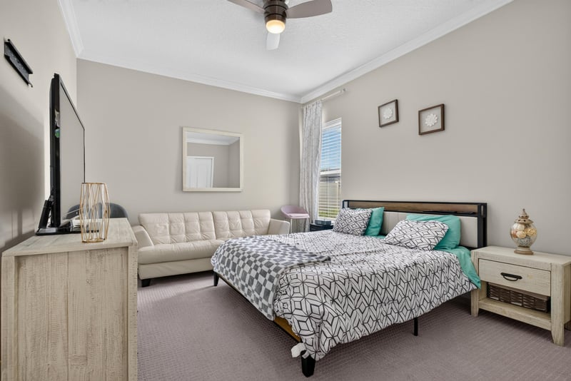 Bedroom with wall-mounted TV at 22 Azura Point