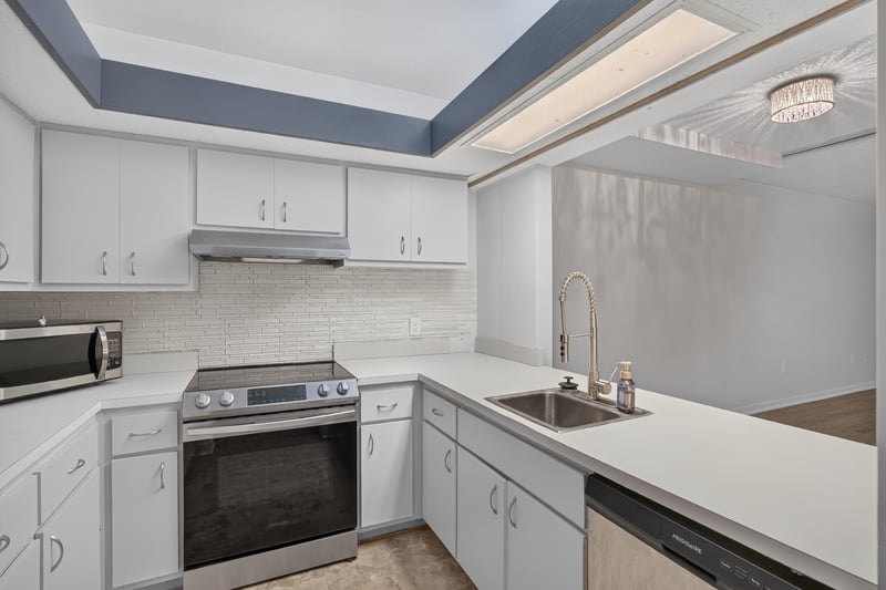 Kitchen sink area with white countertops at 2910 Ravines Rd, Middleburg, FL 32068
