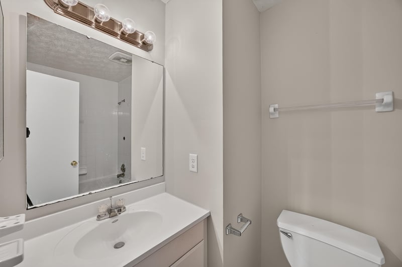 Bathroom vanity with mirror and toilet at 1083 Stokes St, Jacksonville, FL