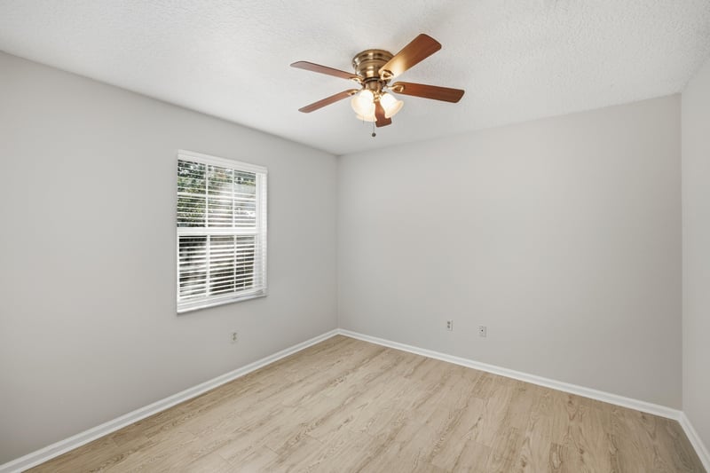 Bedroom with window and ceiling fan at 678 5th Ave N, Jacksonville Beach, FL 32250