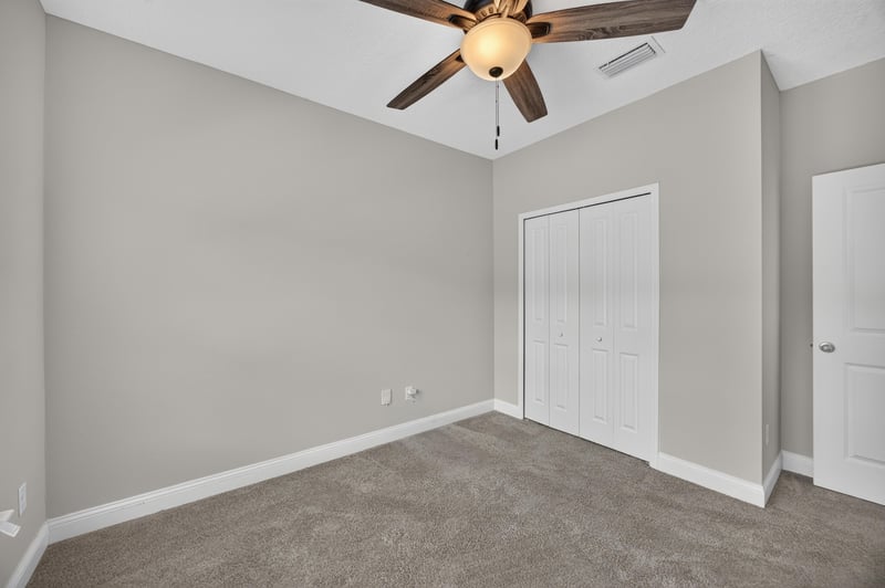 Bedroom with ceiling fan and carpet at 53 Lumen Ct, St. Augustine, FL 32095