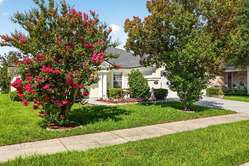Front yard with flowering crepe myrtle at 2282 Justin Lake Dr, Jacksonville, FL