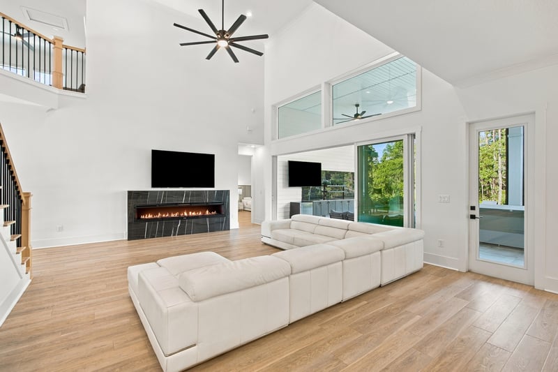 Great room with fireplace and large windows at 907 Seagrove Dr, Ponte Vedra Beach, FL 32081