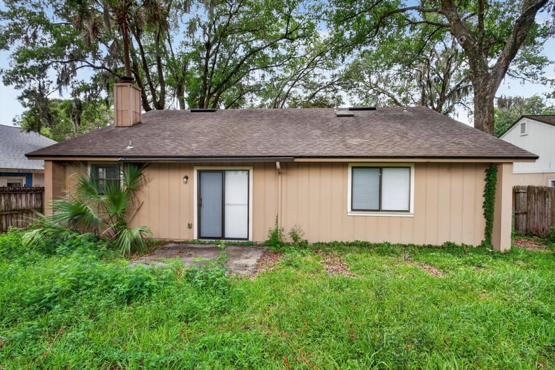 Back door and rear yard view at 1445 Classic Oak Rd W, Jacksonville, FL