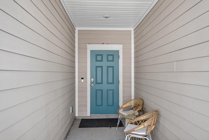 Front door with teal paint at 1186 Beach Dune Dr, Jacksonville, FL 32233