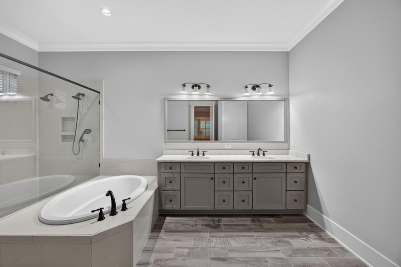 Primary bath with soaking tub and double vanity at 186 Freshwater Dr