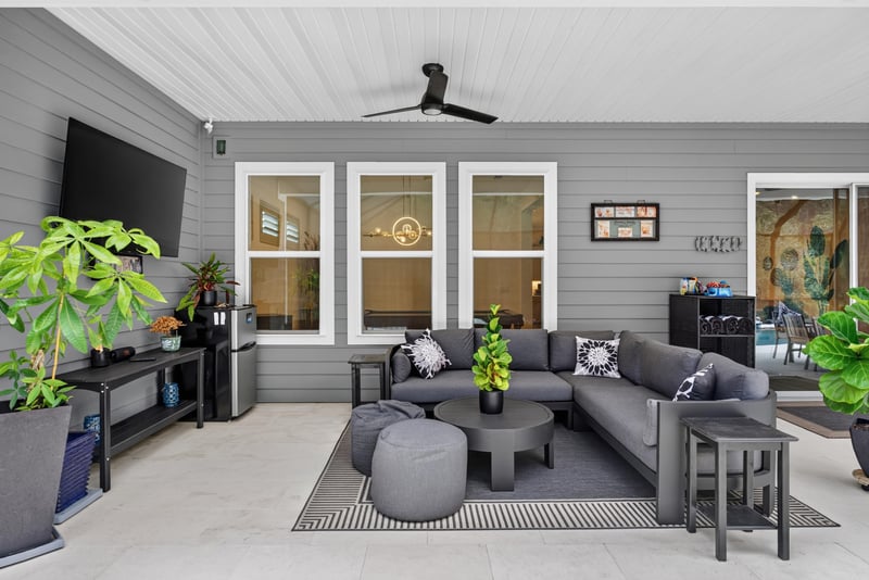 Covered lanai seating with ceiling fan at 785 Back Creek Dr, St. Augustine, FL 32092