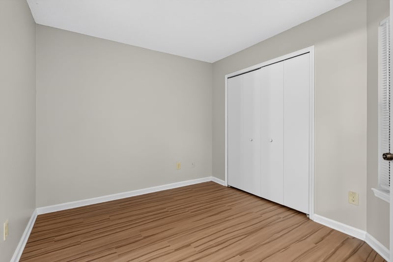 Bedroom closet with sliding doors at 8010 International Village Dr, Jacksonville, FL 32277