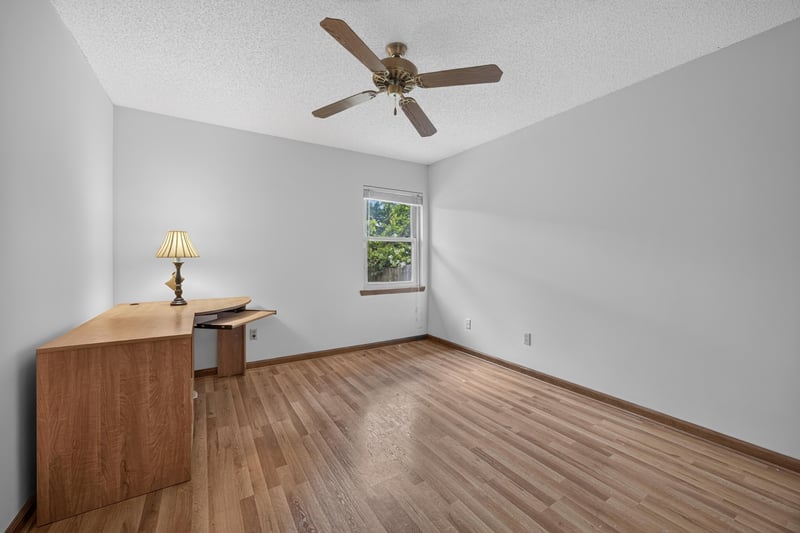 Empty room with wood floor and single window at 2460 San Sago Ln, Jacksonville, FL