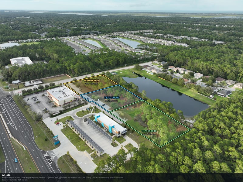 Aerial view of the pond, tree canopy, and commercial building at 4900 US-1, St. Augustine, FL 32086