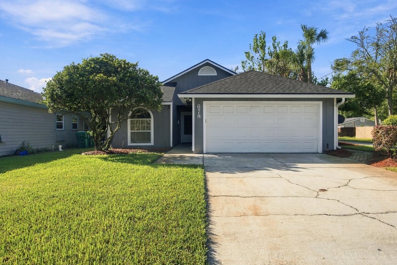 Front exterior with landscaping at 678 5th Ave N, Jacksonville Beach, FL 32250