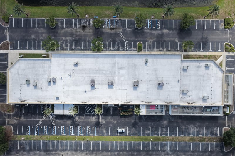 Aerial view of a long building roofline with parking at 10550 Deerwood Park Blvd, Jacksonville, FL 32256