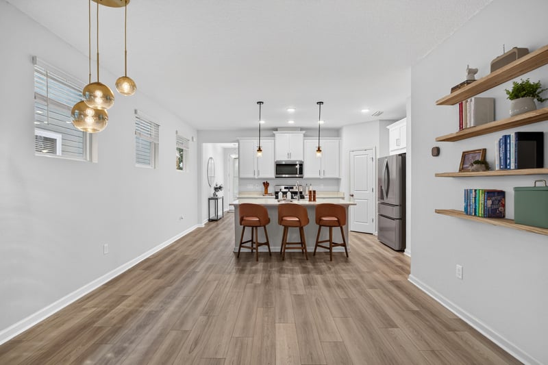 Open floor plan view toward kitchen from living room at 93 Lochloosa Ct, St. Johns, FL 32259