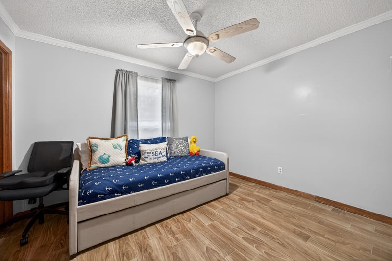Bedroom with daybed and desk chair at 981 Marble Ridge Dr, Orange Park, FL 32065